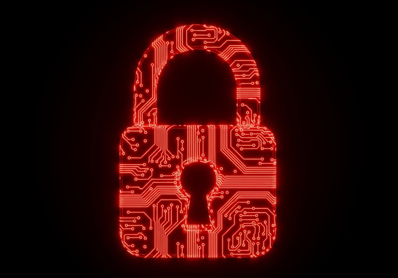 A closed padlock drawn in glowing red circuit-board traces on a black background